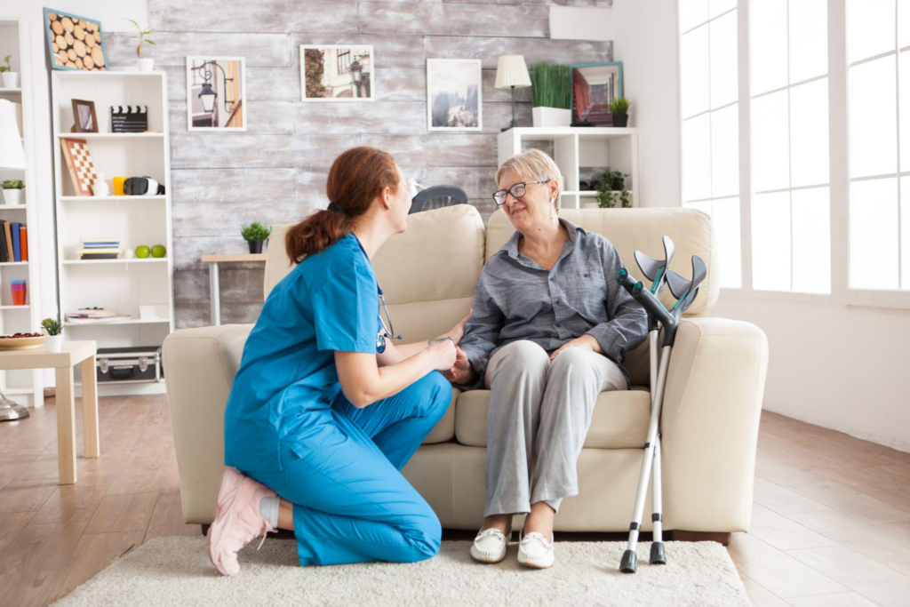 Caregiver assisting an older adult at home to reduce fall risks through personalized in-home senior care in Gloucester County, NJ.