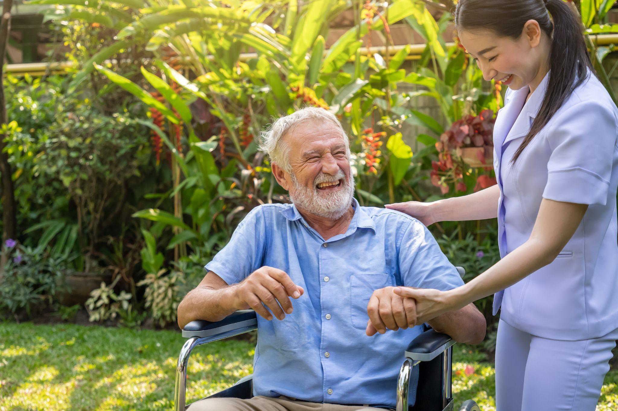Older adult enjoying time outdoors with supportive assistance in Camden County, NJ