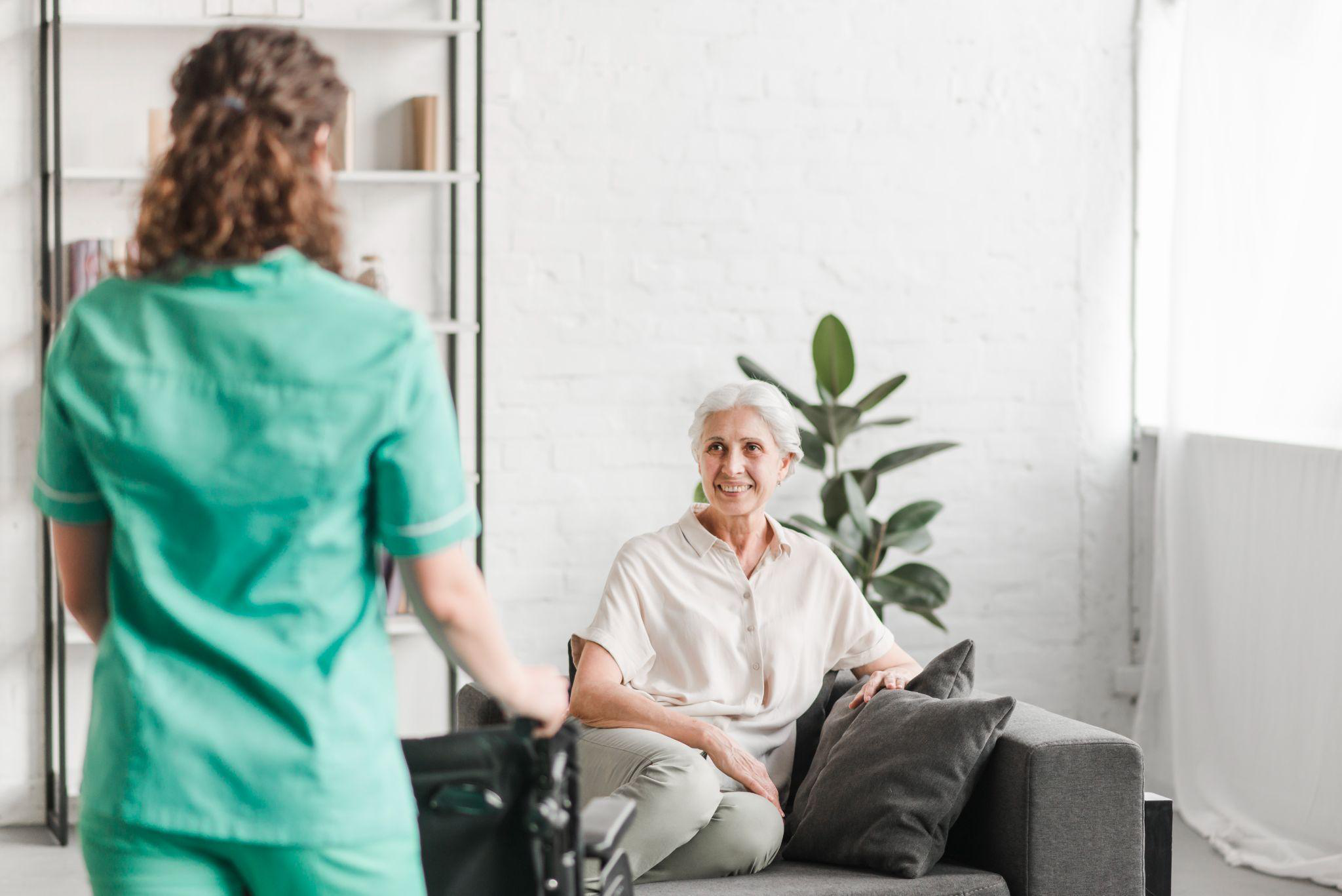 Older adult spending time with a caregiver at home as part of ongoing senior support in Burlington County, NJ.